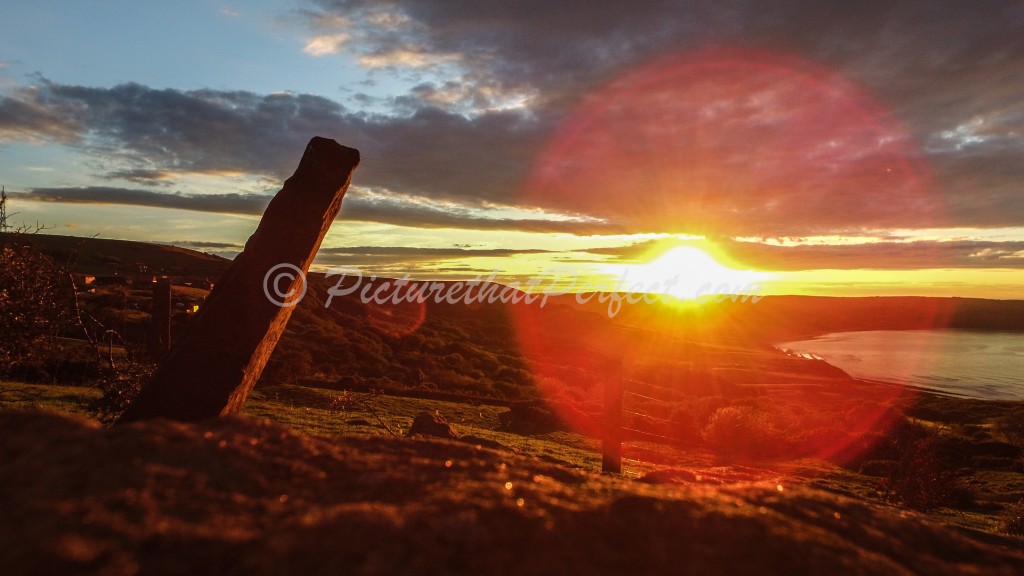 Bay with stone sunset